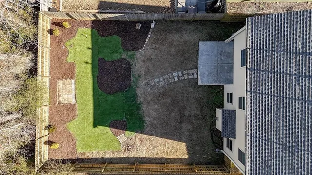 a view of residential houses with yard and stairs