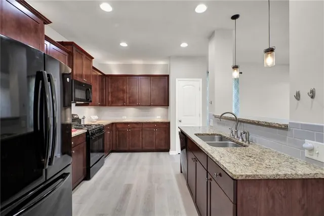a view of a kitchen cabinets and wooden floor