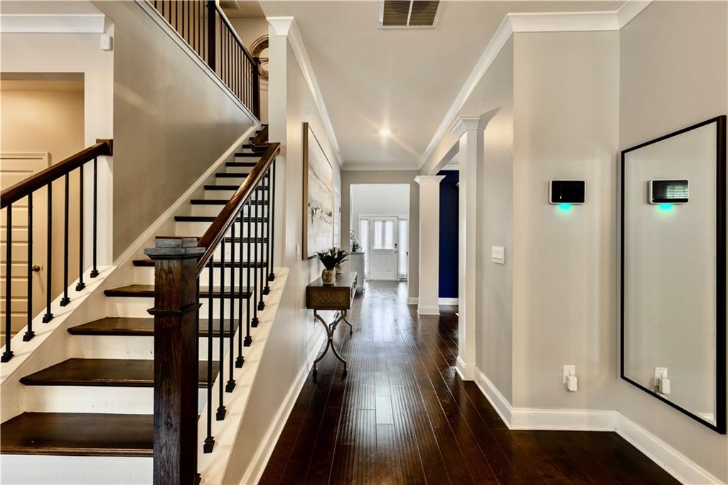 133 Canal Street Hampton, GA 30228 - Photo 11 of 43 a view of entryway with wooden floor and stairs