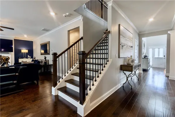 a view of entryway and hall with wooden floor