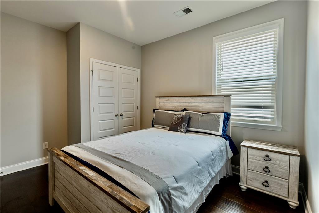 133 Canal Street Hampton, GA 30228 - Photo 22 of 43 a bedroom with a bed and a window