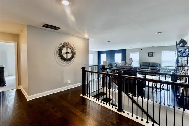 a view of a room with wooden floor