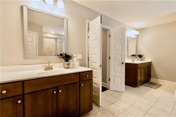 a kitchen with a sink and a mirror