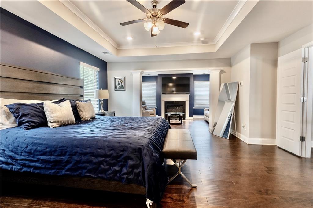 133 Canal Street Hampton, GA 30228 - Photo 31 of 43 a bed room with a bed and a fireplace