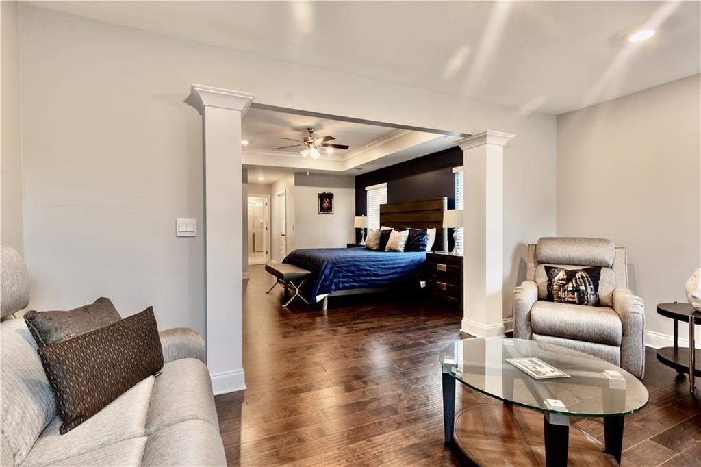 133 Canal Street Hampton, GA 30228 - Photo 34 of 43 a living room with furniture and a wooden floor