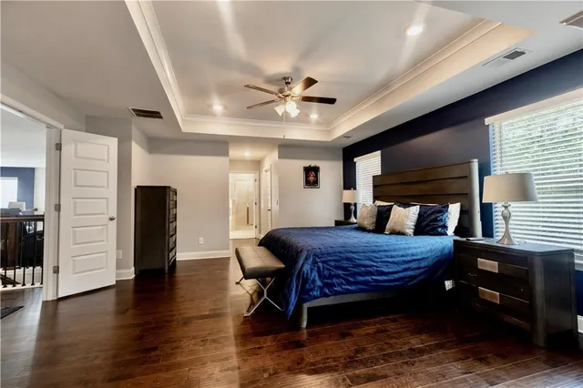 a bed room with furniture and wooden floor