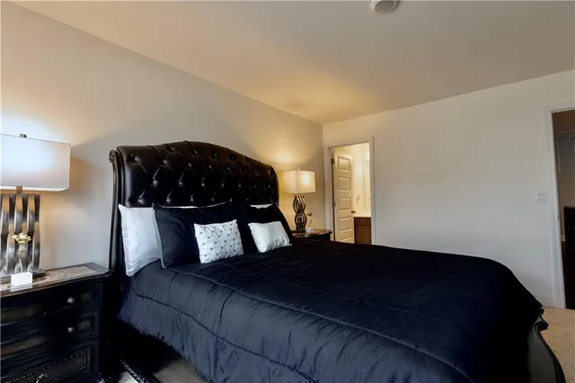 a bedroom with a bed window and wall painting