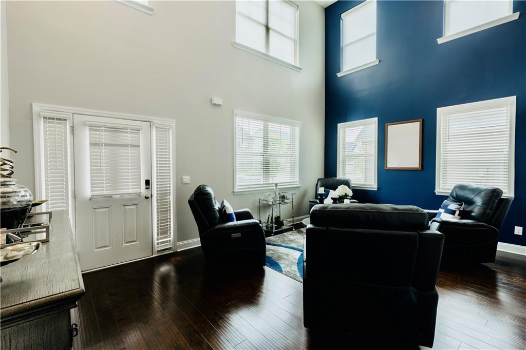 133 Canal Street Hampton, GA 30228 - Photo 6 of 43 a living room with furniture and a large window