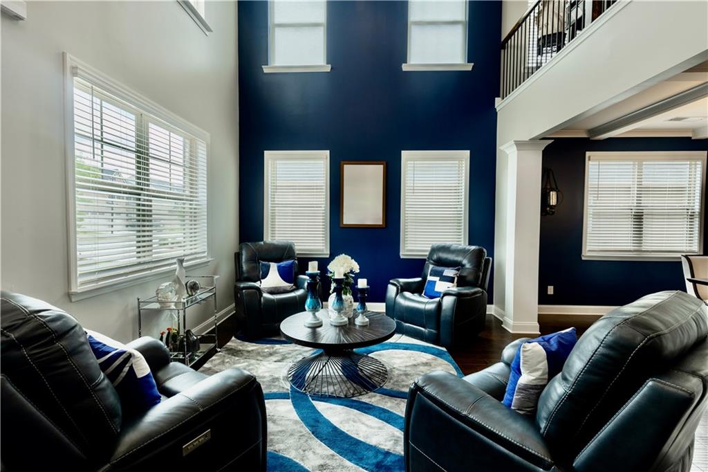 133 Canal Street Hampton, GA 30228 - Photo 7 of 43 a living room with furniture and a large window