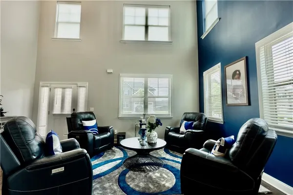 a living room with furniture fireplace and window