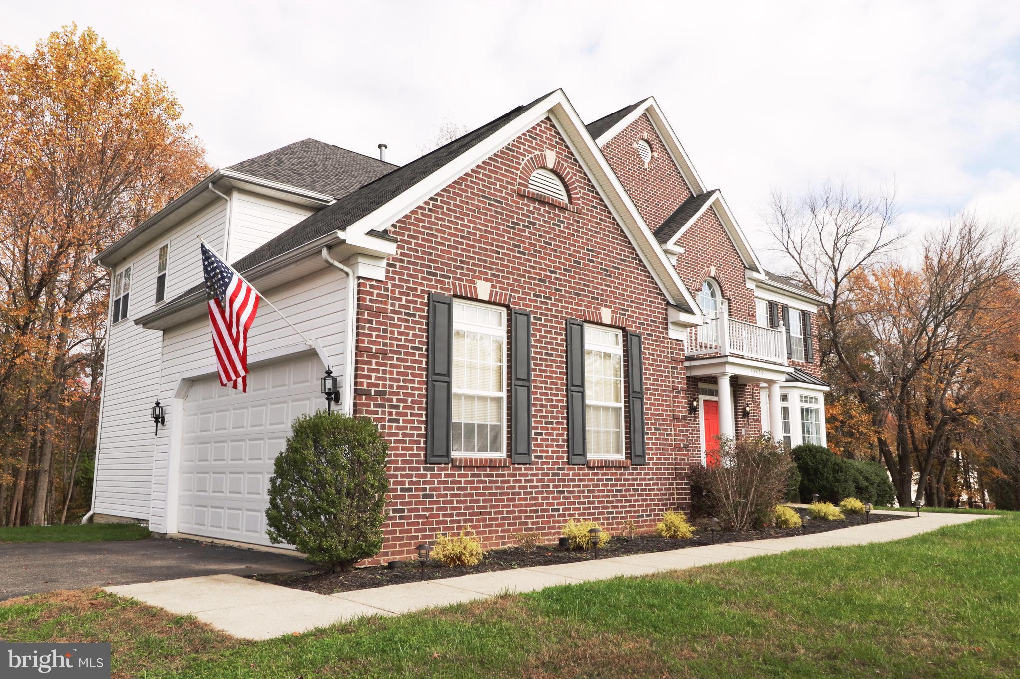 14406 Dunstable Court Bowie, MD 20721 - Photo 2 of 30 a front view of a house with a yard