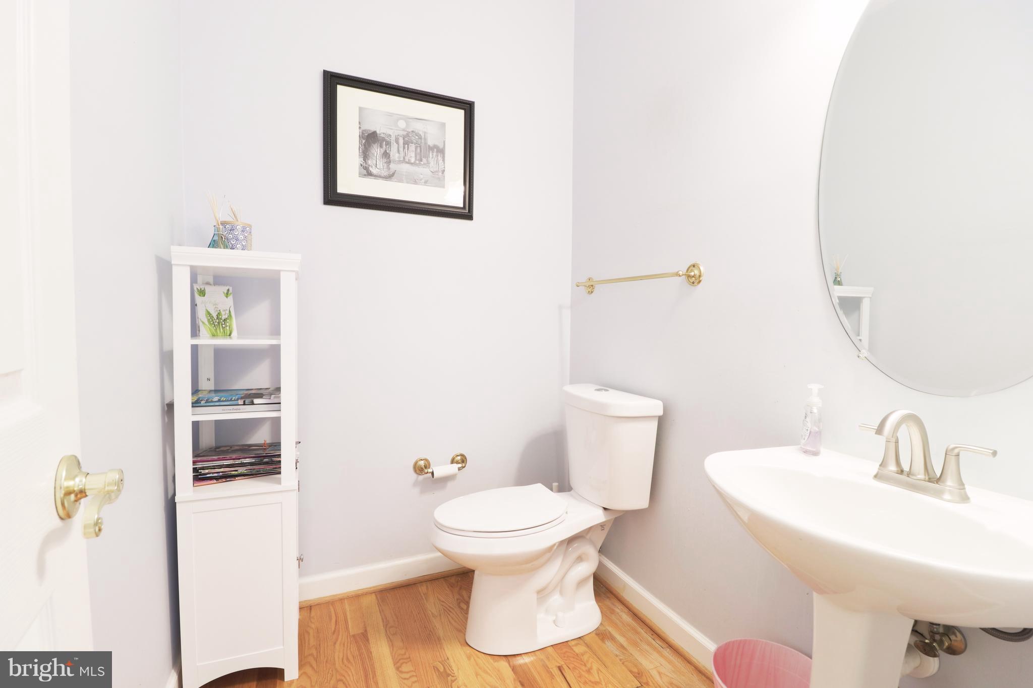 14406 Dunstable Court Bowie, MD 20721 - Photo 14 of 30 a bathroom with a toilet sink and mirror