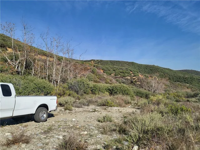 a view of a car is parked in a field