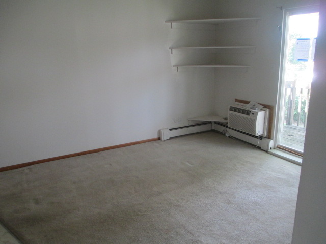 2600 Light Road, Unit 202 Oswego, IL 60543 - Photo 4 of 12 an empty room with a empty space and a window