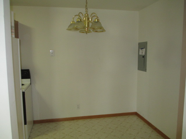 2600 Light Road, Unit 202 Oswego, IL 60543 - Photo 7 of 12 an empty room with a door