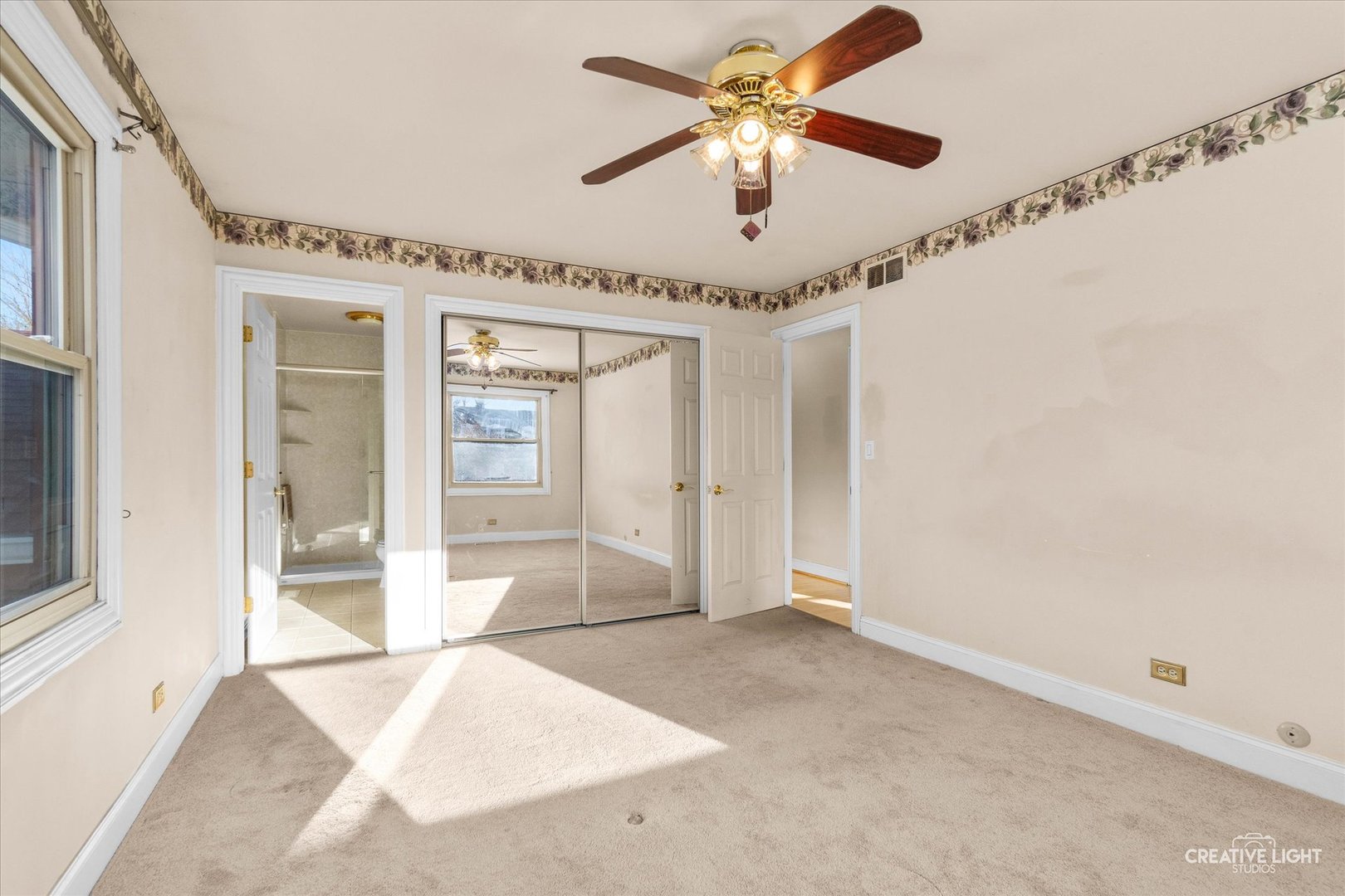 425 Carriage Hill Road Naperville, IL 60565 - Photo 14 of 37 an empty room with windows and fan