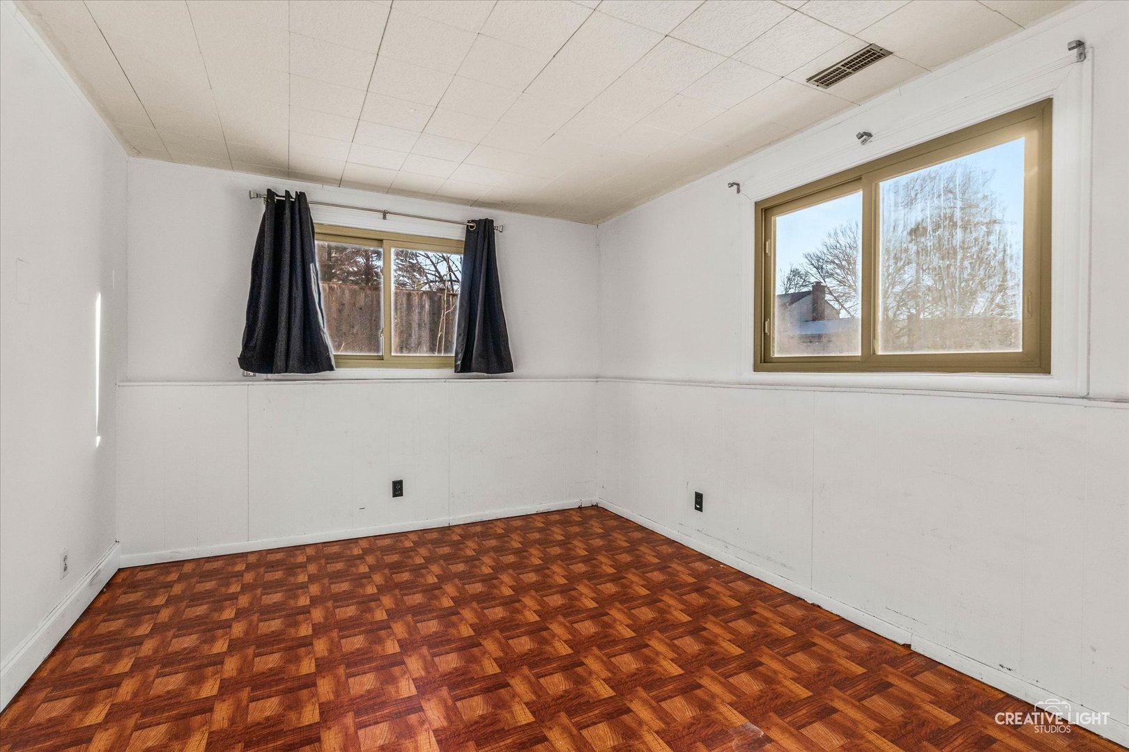 425 Carriage Hill Road Naperville, IL 60565 - Photo 22 of 37 a view of a room with wooden floor and a window