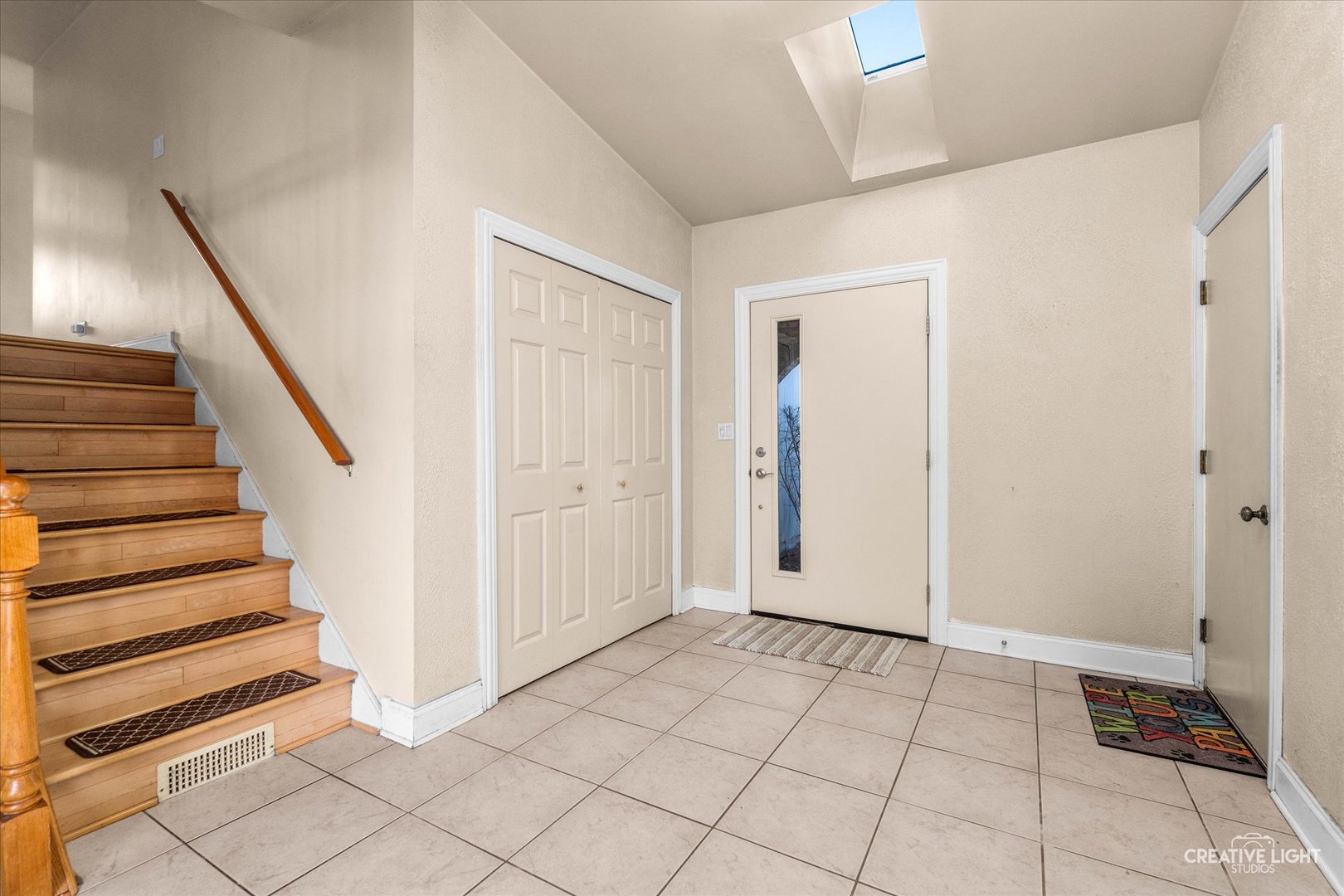 425 Carriage Hill Road Naperville, IL 60565 - Photo 4 of 37 a view of an entryway with staircase