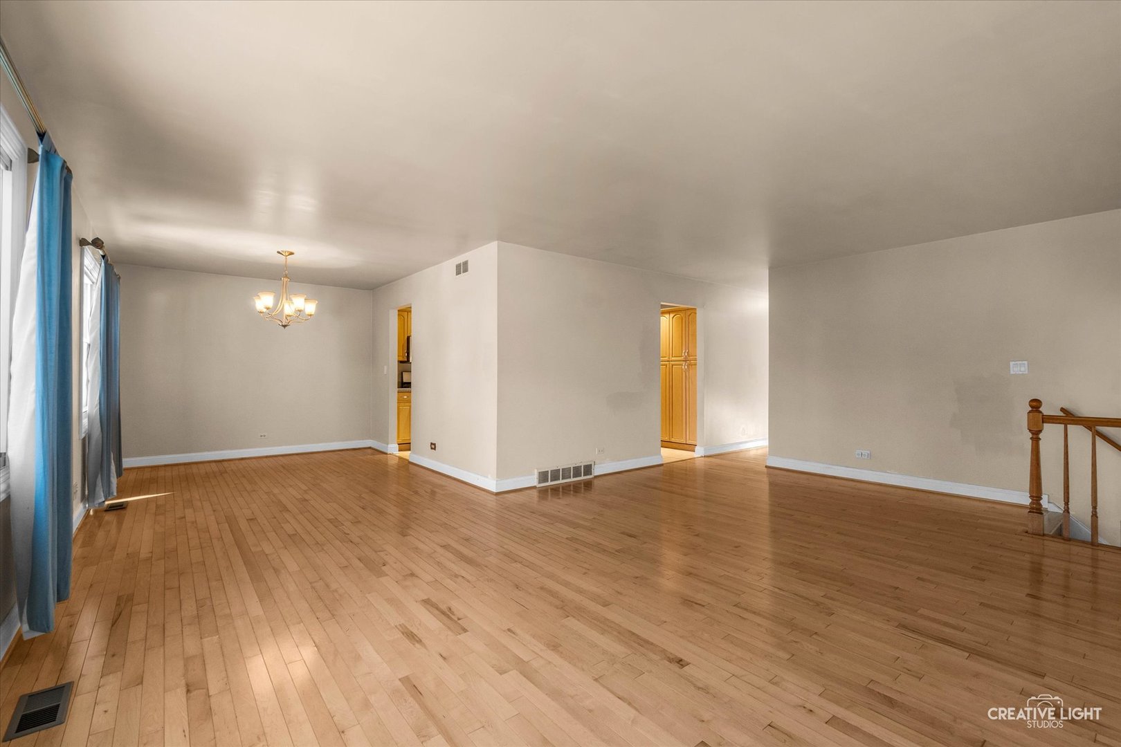 425 Carriage Hill Road Naperville, IL 60565 - Photo 7 of 37 a view of an empty room with wooden floor