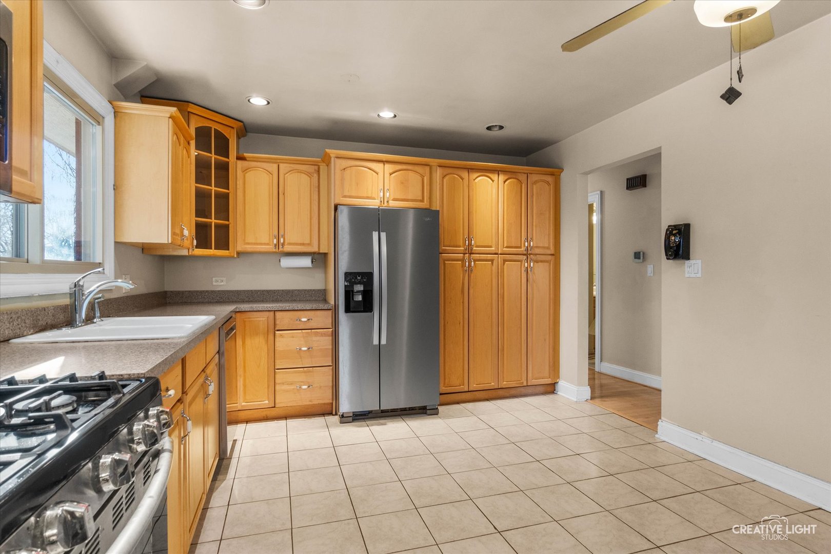 425 Carriage Hill Road Naperville, IL 60565 - Photo 10 of 37 a kitchen with stainless steel appliances granite countertop a refrigerator and a sink