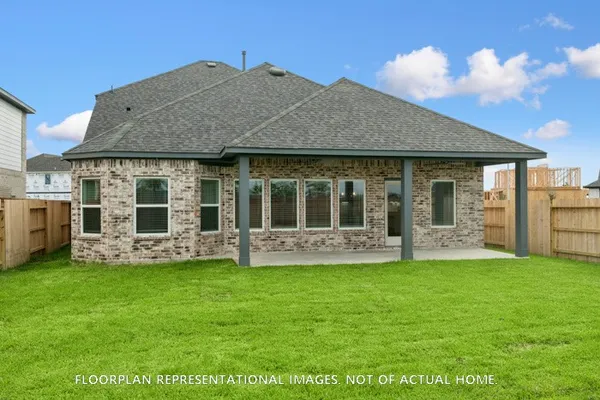a bedroom with a bed a table and chair
