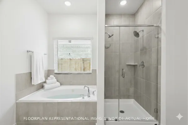 a spacious bathroom with a sink and a mirror