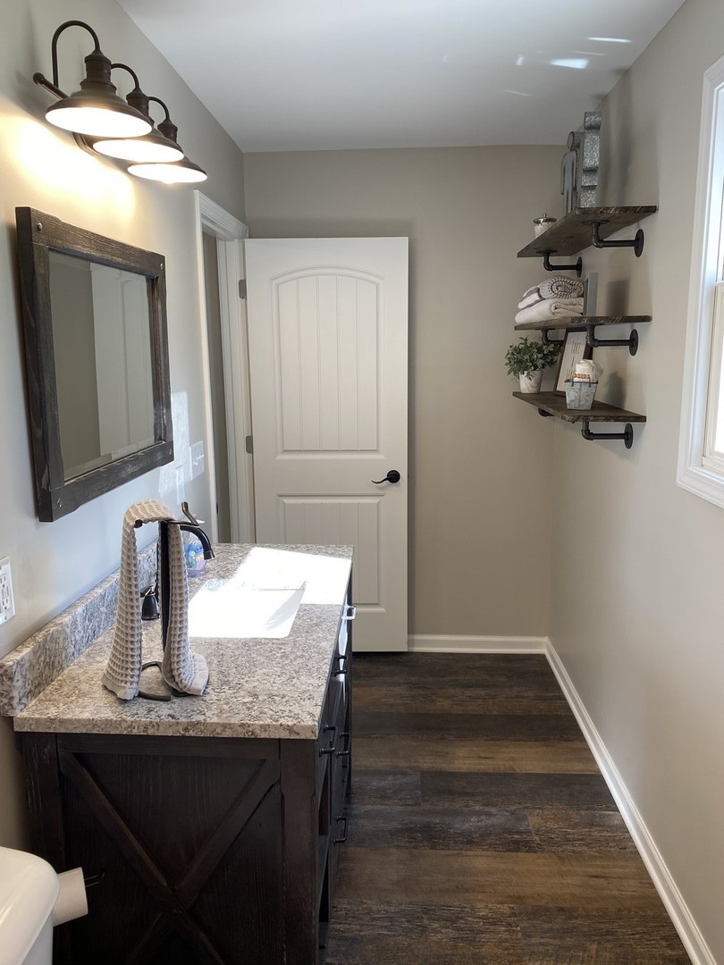 430 South 1st Street DeKalb, IL 60115 - Photo 18 of 34 a kitchen with sink and refrigerator