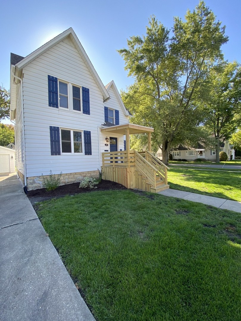 430 South 1st Street DeKalb, IL 60115 - Photo 3 of 34 a front view of house with yard and swimming pool