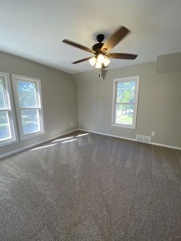 430 South 1st Street DeKalb, IL 60115 - Photo 27 of 34 an empty room with windows and fan
