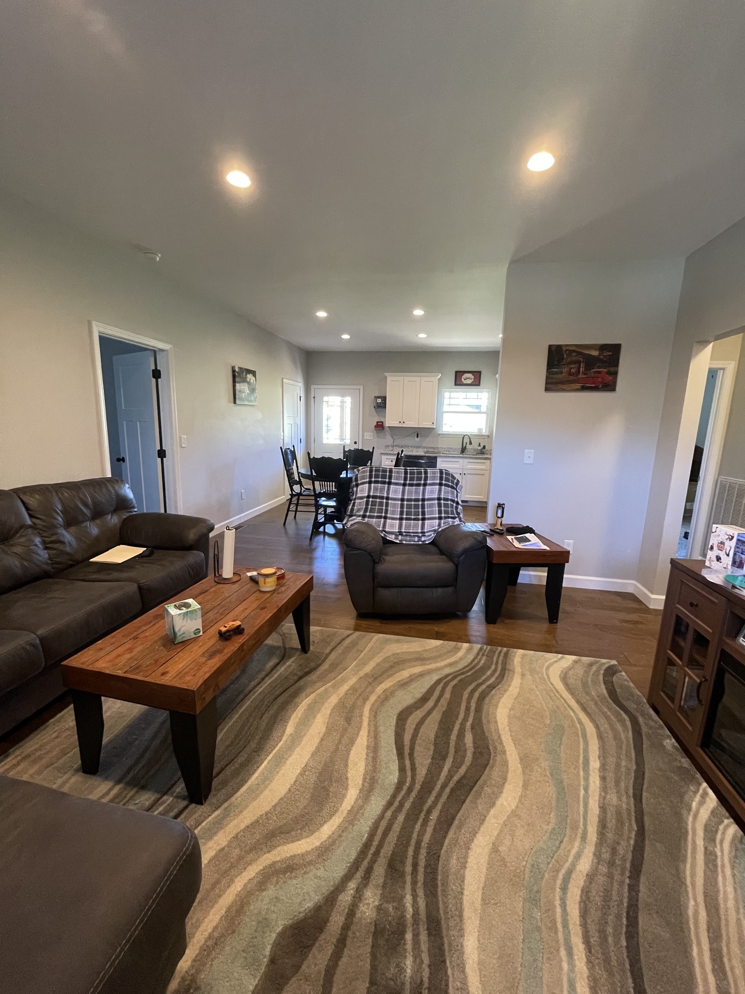 528 Matlock Road Charlotte, TN 37036 - Photo 11 of 26 a living room with furniture a flat screen tv and a table