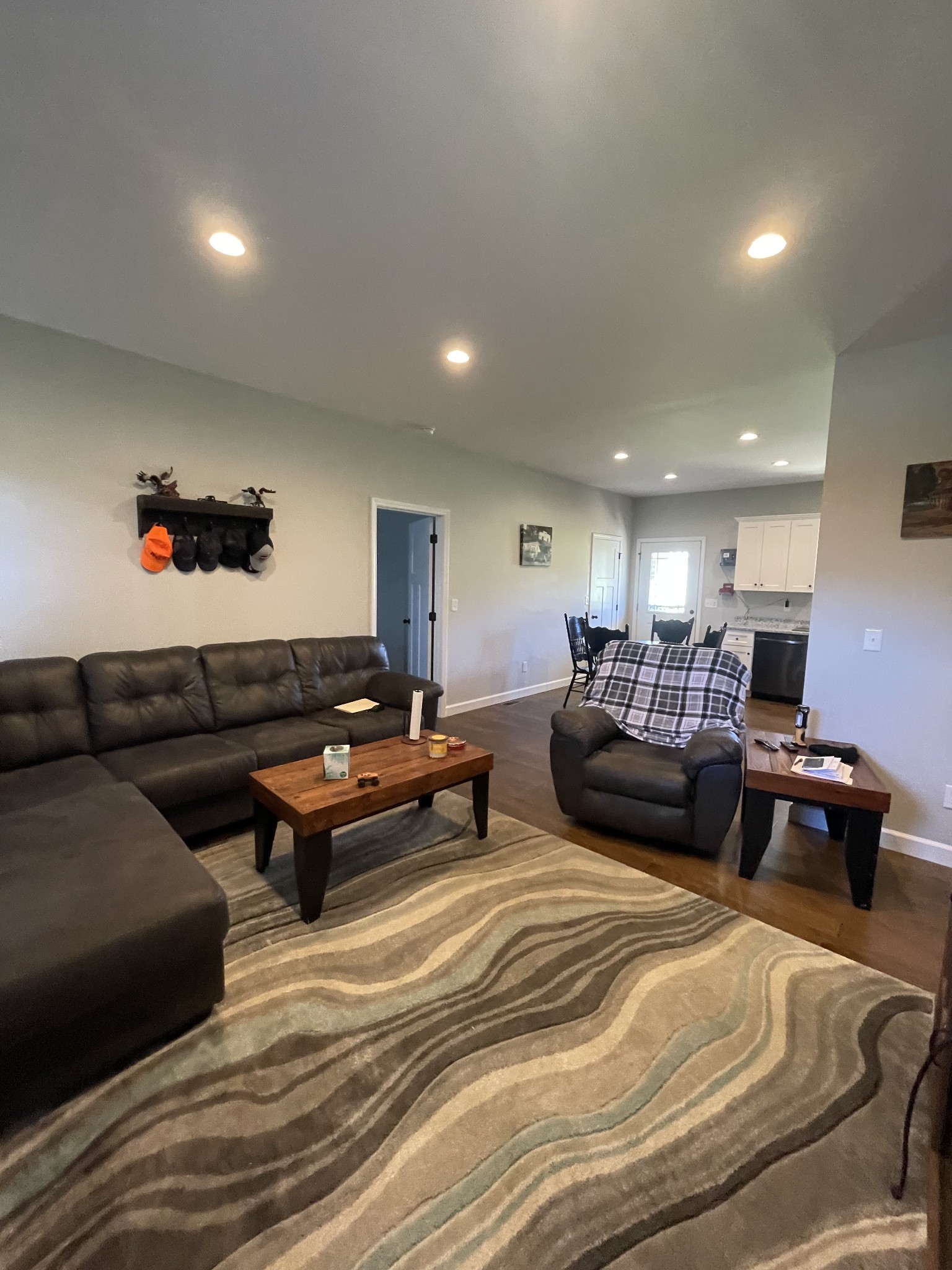 528 Matlock Road Charlotte, TN 37036 - Photo 12 of 26 a living room with furniture a rug and a chandelier