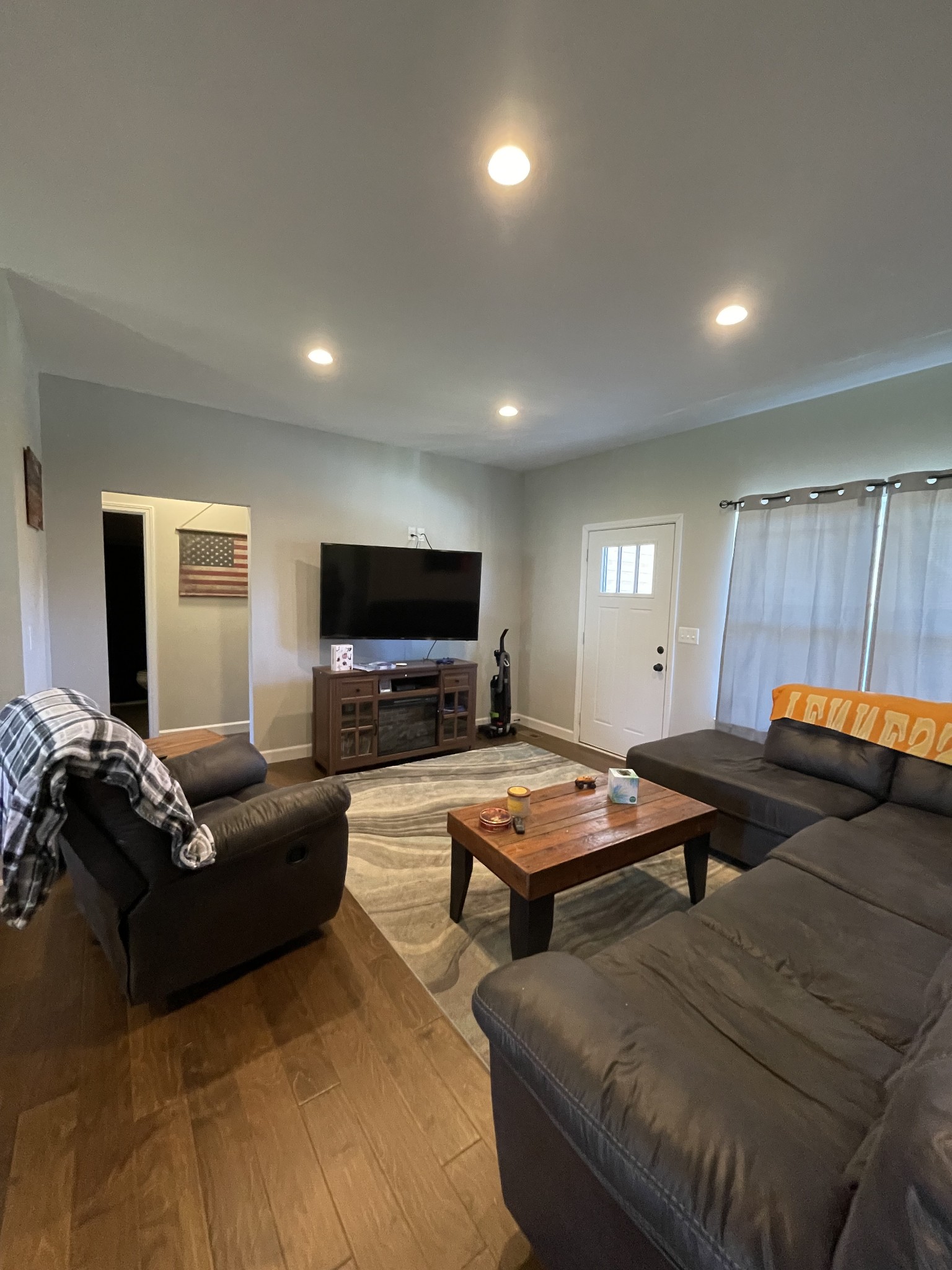 528 Matlock Road Charlotte, TN 37036 - Photo 13 of 26 a living room with furniture and a flat screen tv