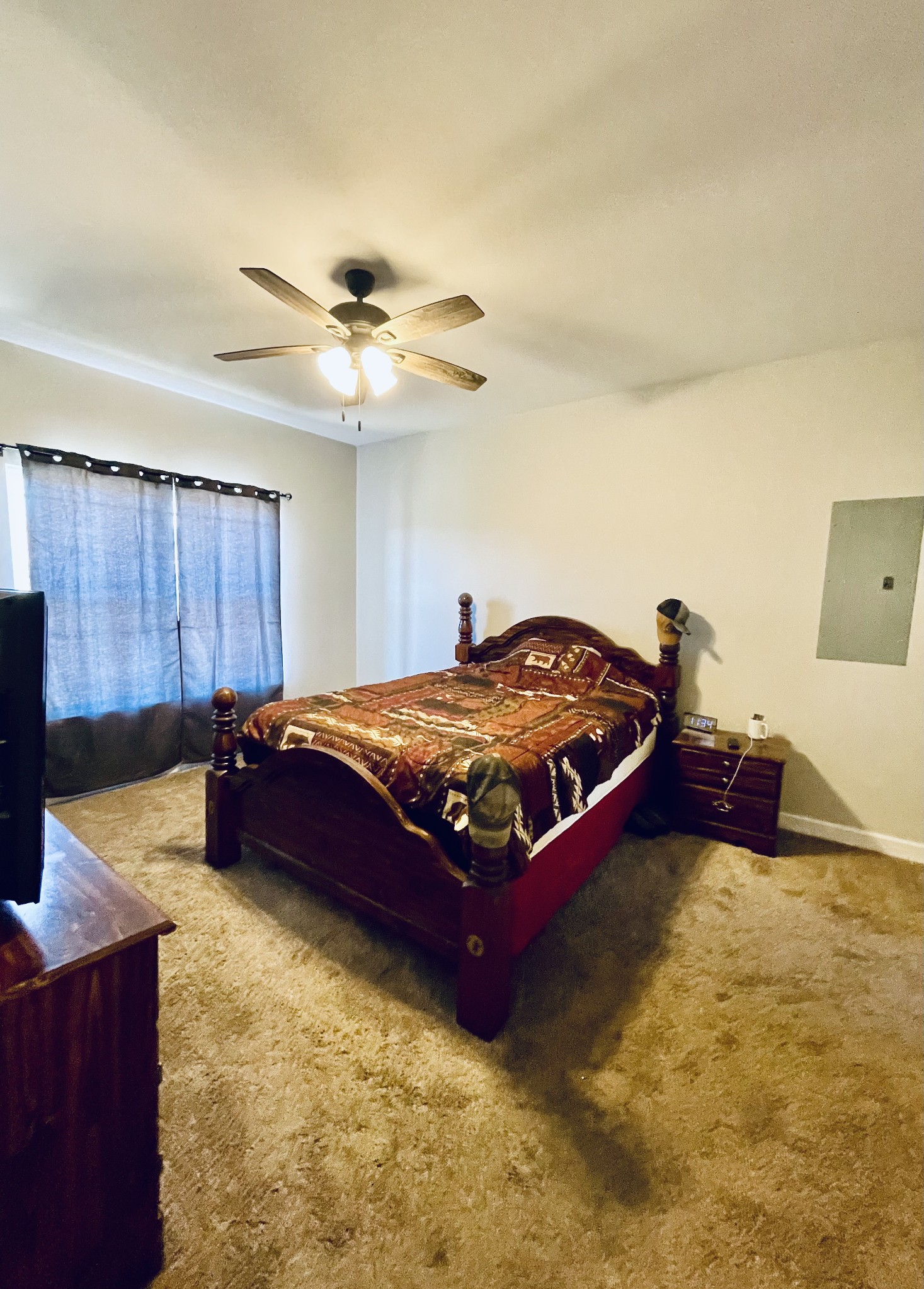 528 Matlock Road Charlotte, TN 37036 - Photo 18 of 26 a bedroom with a bed and dresser with wooden floor