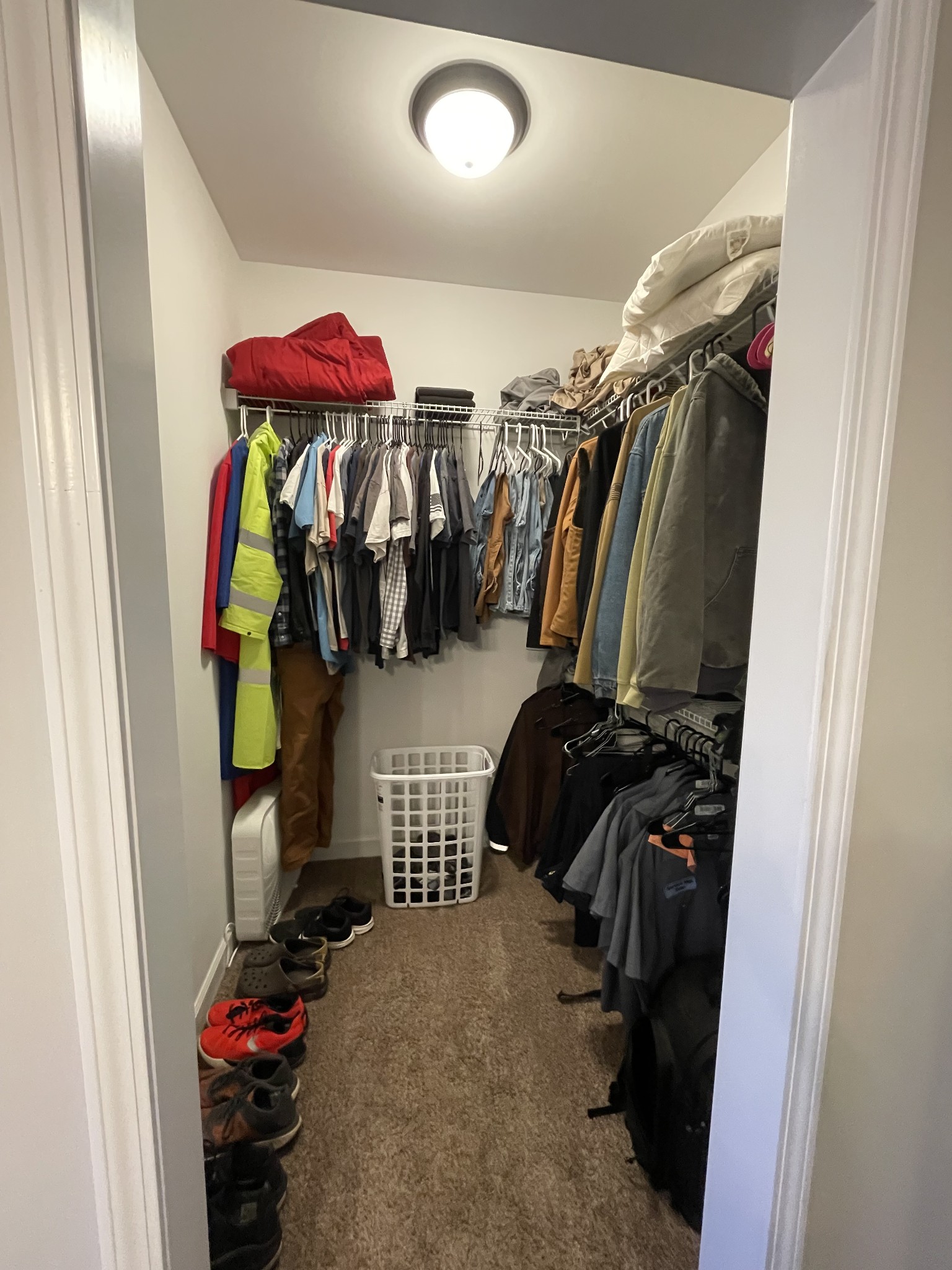 528 Matlock Road Charlotte, TN 37036 - Photo 19 of 26 a view of walk in closet with clothes and shoes