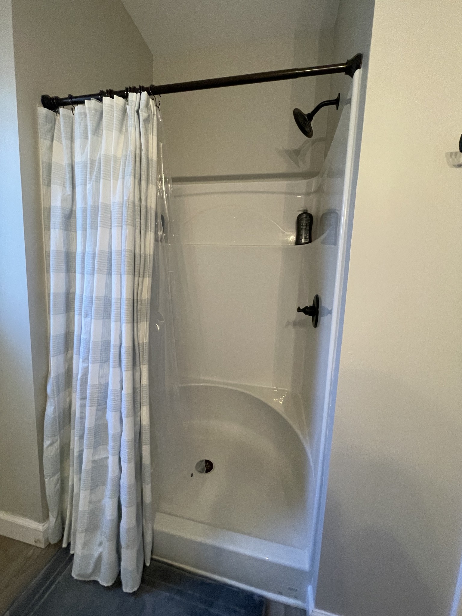 528 Matlock Road Charlotte, TN 37036 - Photo 20 of 26 a bathroom with a glass shower door