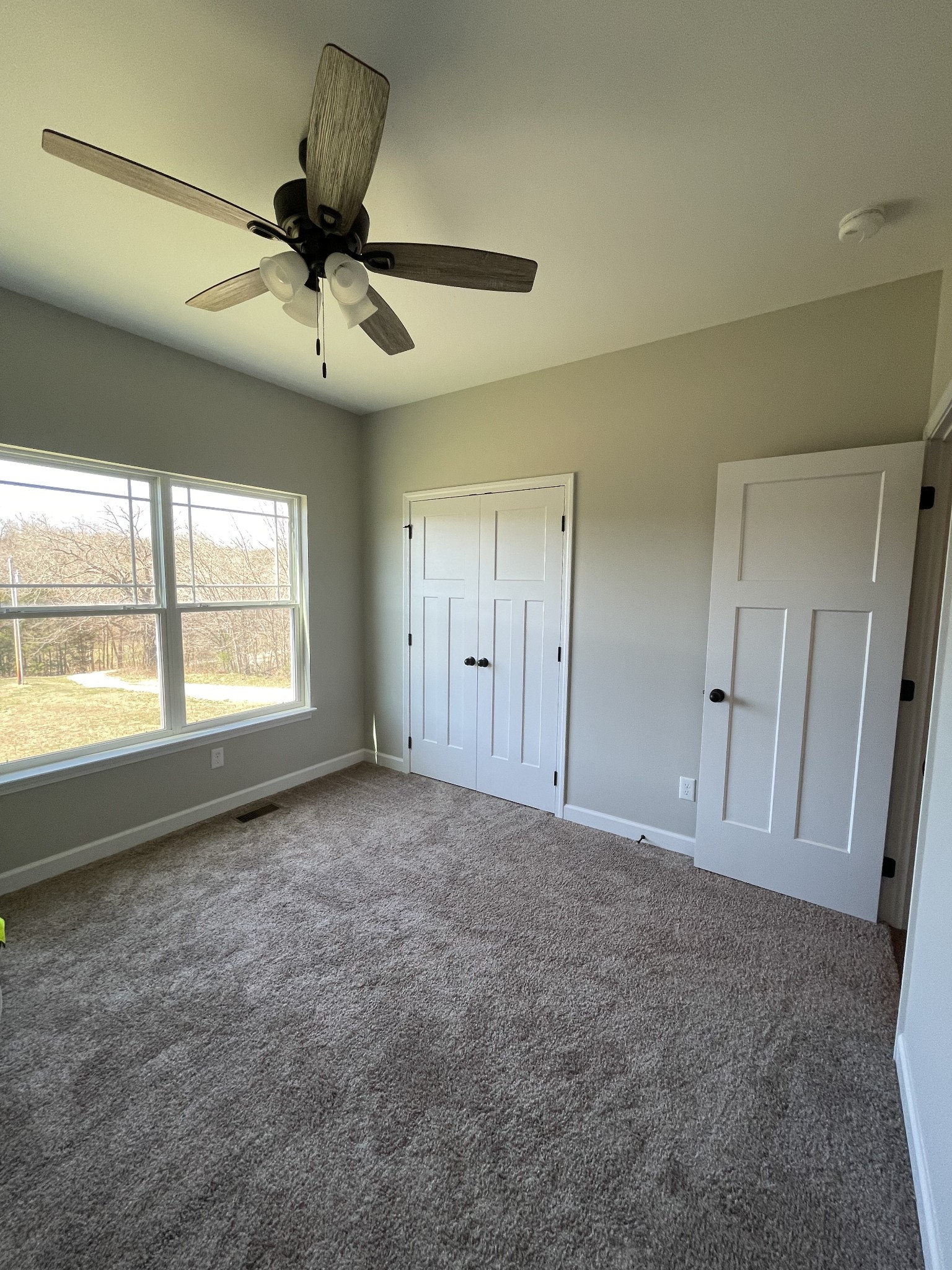 528 Matlock Road Charlotte, TN 37036 - Photo 22 of 26 a view of an empty room with a window