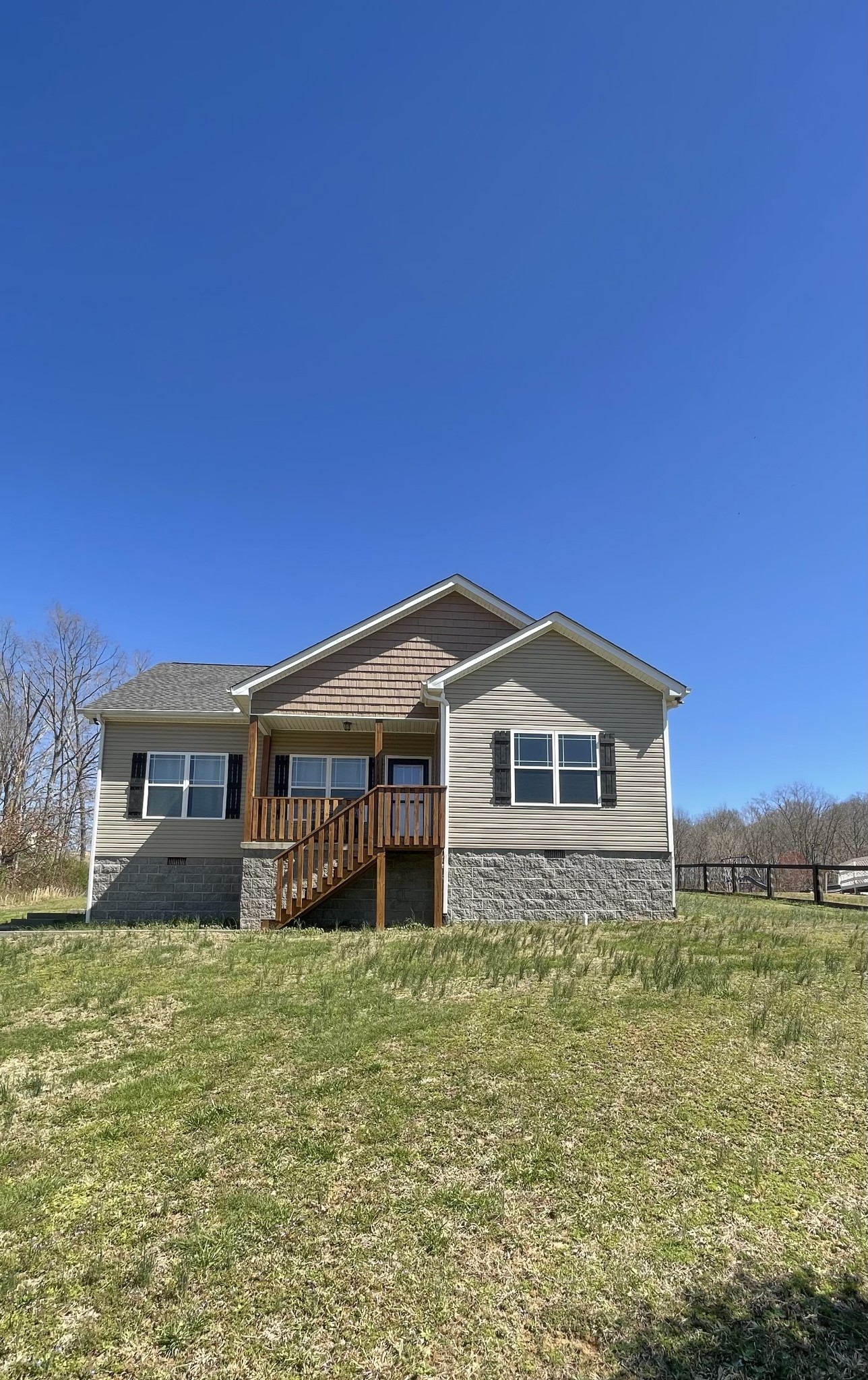 528 Matlock Road Charlotte, TN 37036 - Photo 25 of 26 a large house with a big yard and large trees