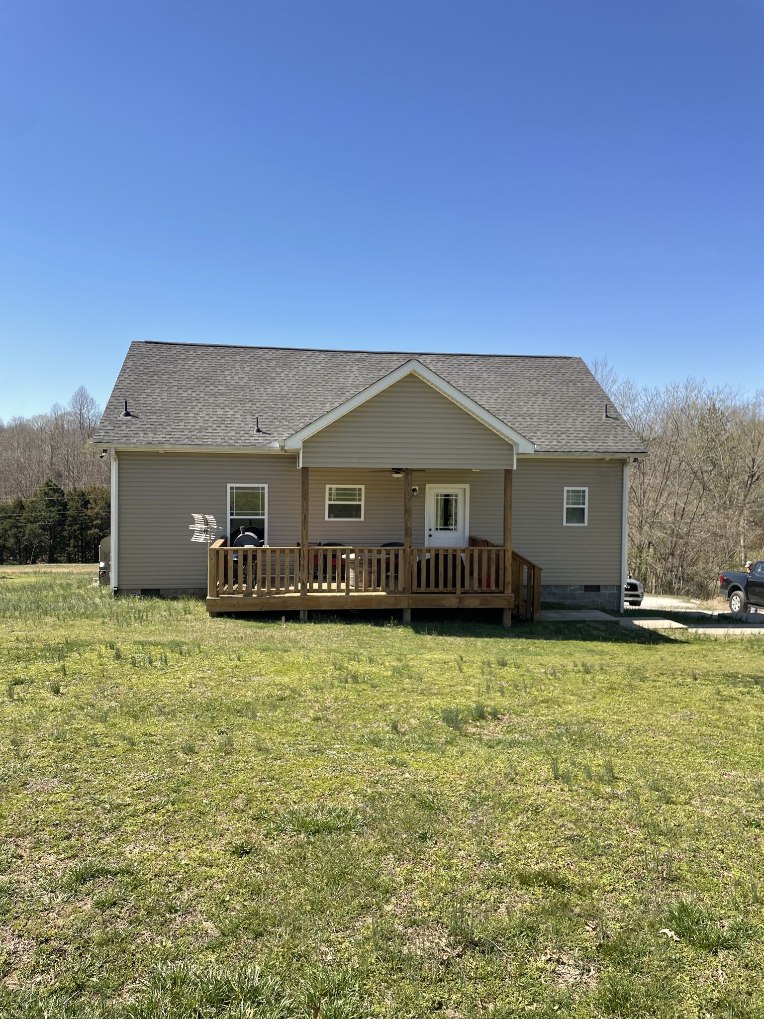 528 Matlock Road Charlotte, TN 37036 - Photo 5 of 26 a front view of a house with a garden