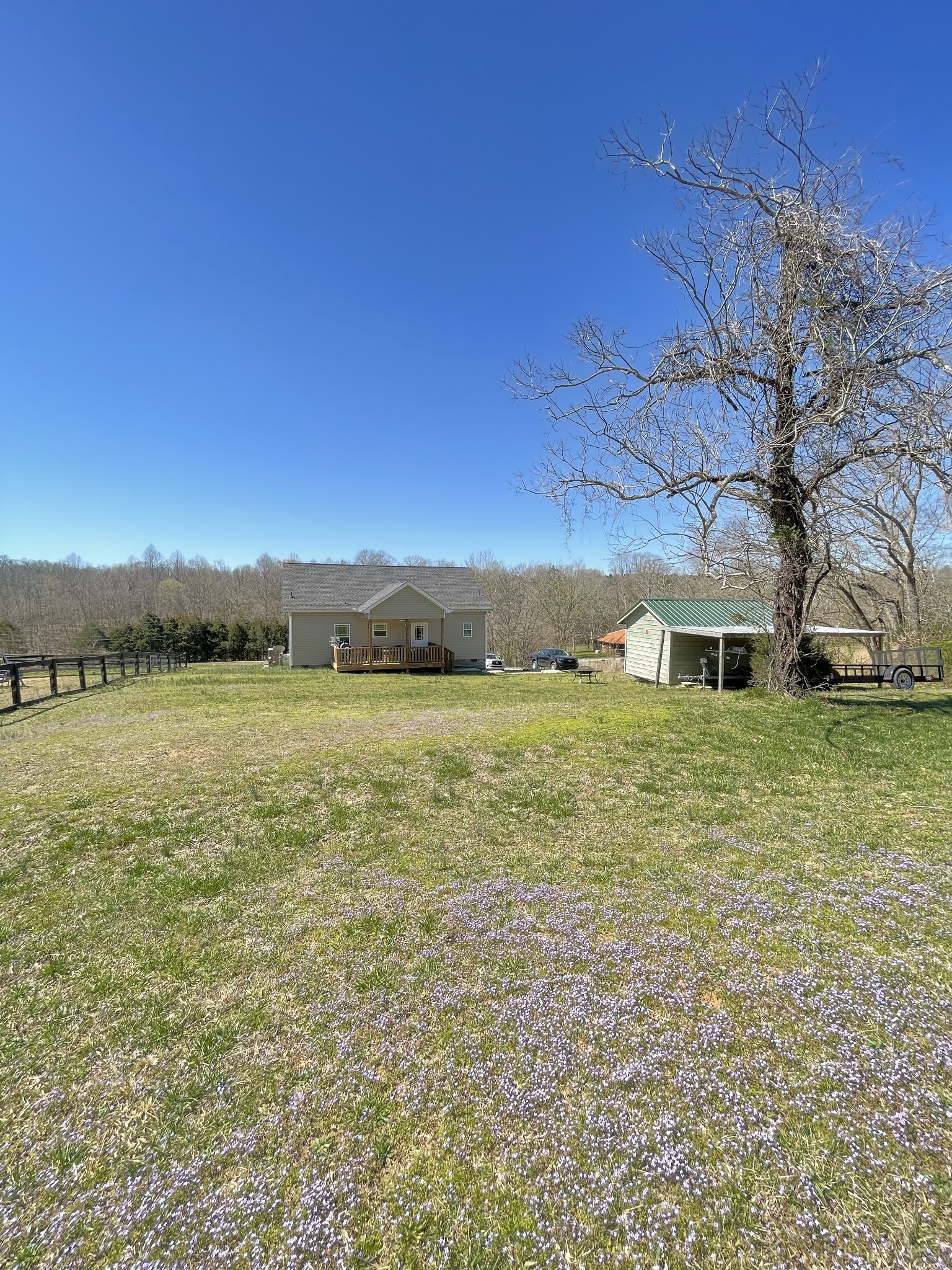 528 Matlock Road Charlotte, TN 37036 - Photo 7 of 26 a large house with a lake view