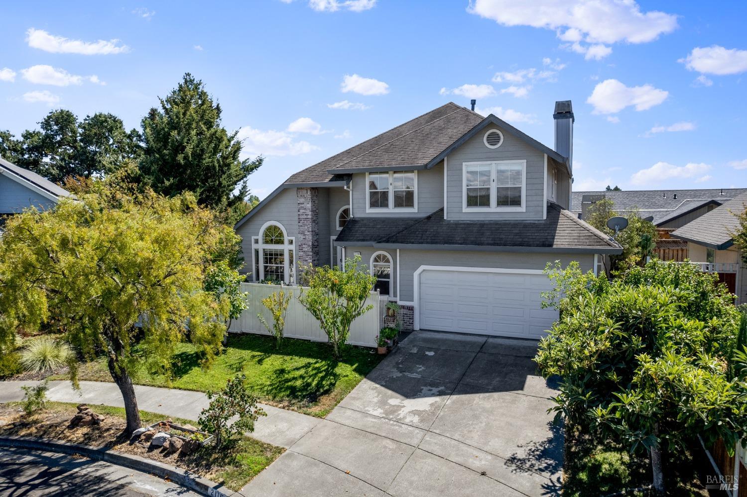 2116 Bock Street Santa Rosa, CA 95403 - Photo 1 of 1 a front view of a house with a yard