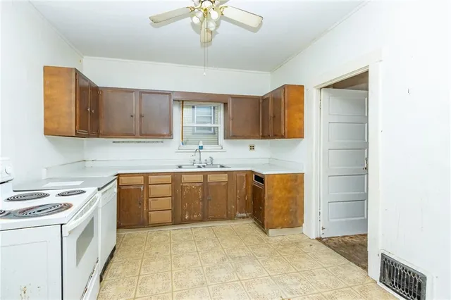 a kitchen with stainless steel appliances granite countertop a sink and cabinets
