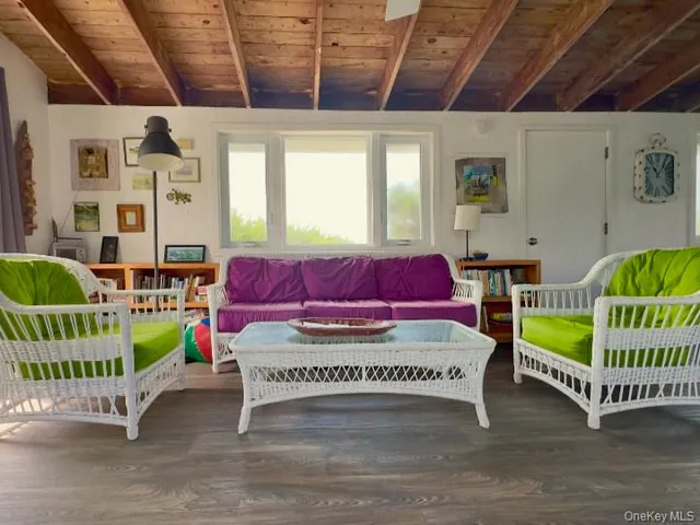 a living room with baby crib furniture and a baby crib