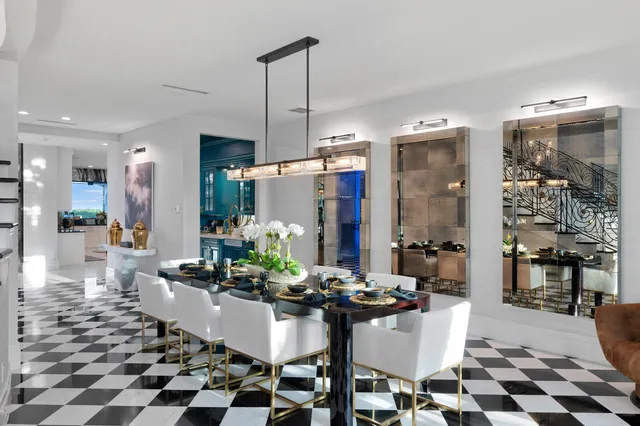 a large white room with a large window and a sink