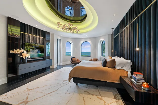 a living room with lots of furniture and a chandelier