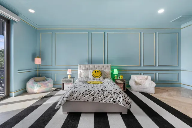 a front view of multiple houses with yard