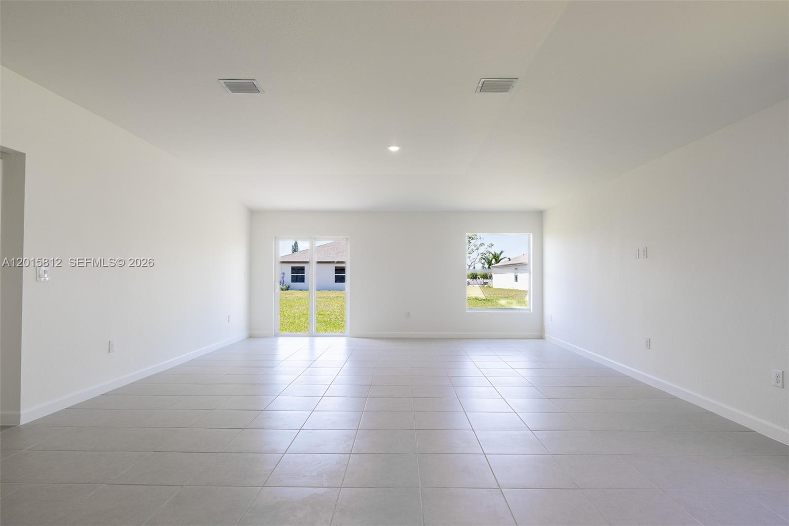 17564 Southwest 285th Street Homestead, FL 33030 - Photo 11 of 42 a view of an empty room with a window