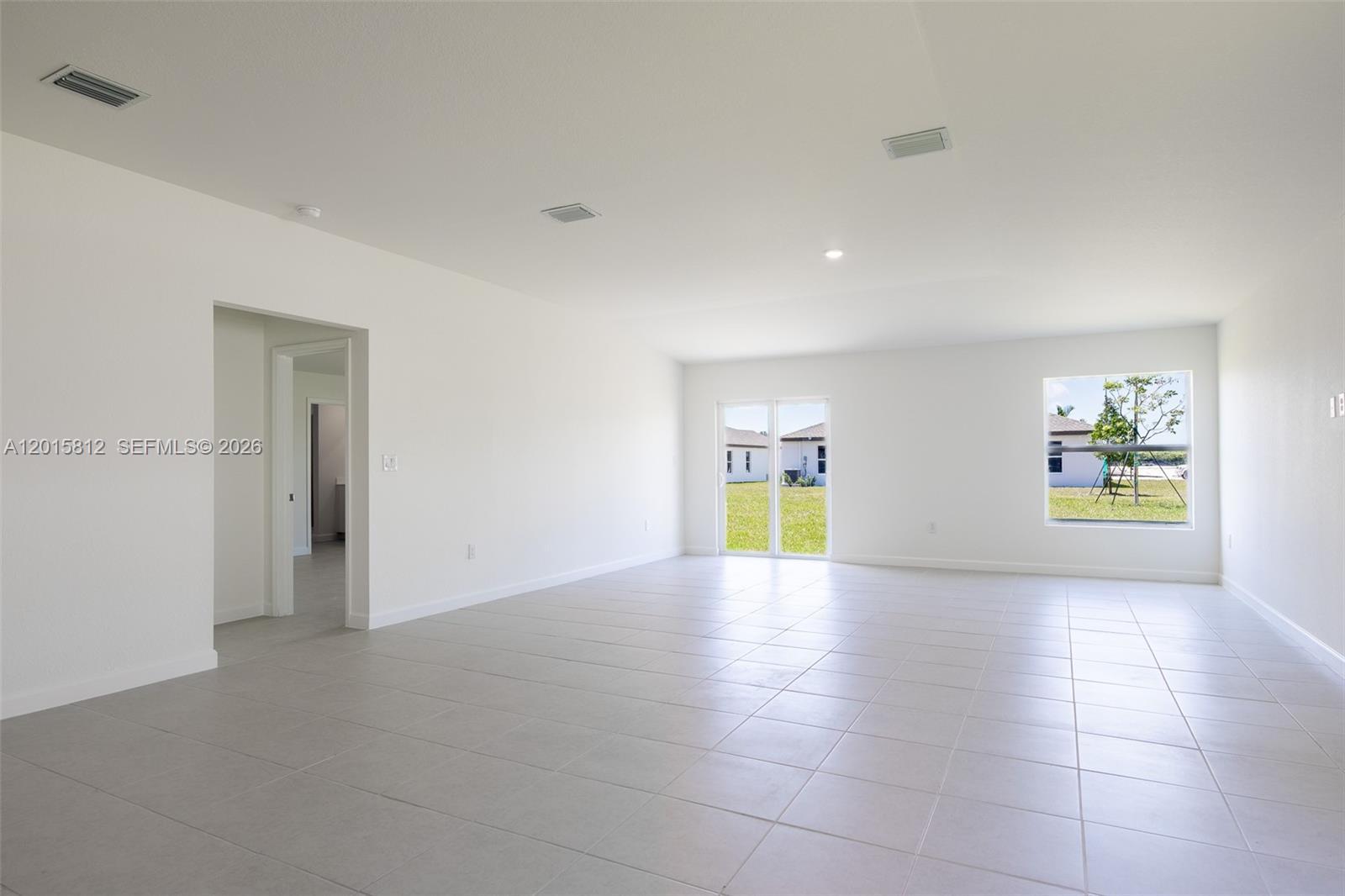 17564 Southwest 285th Street Homestead, FL 33030 - Photo 12 of 42 a view of an empty room and window