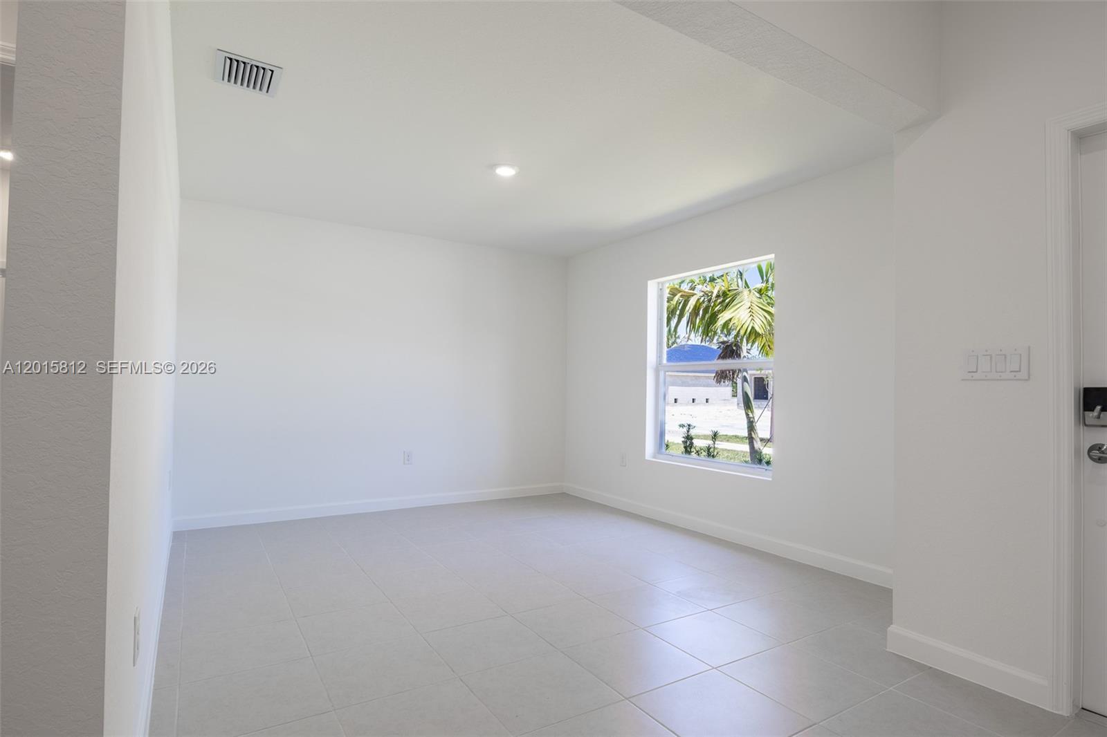 17564 Southwest 285th Street Homestead, FL 33030 - Photo 14 of 42 an empty room with windows