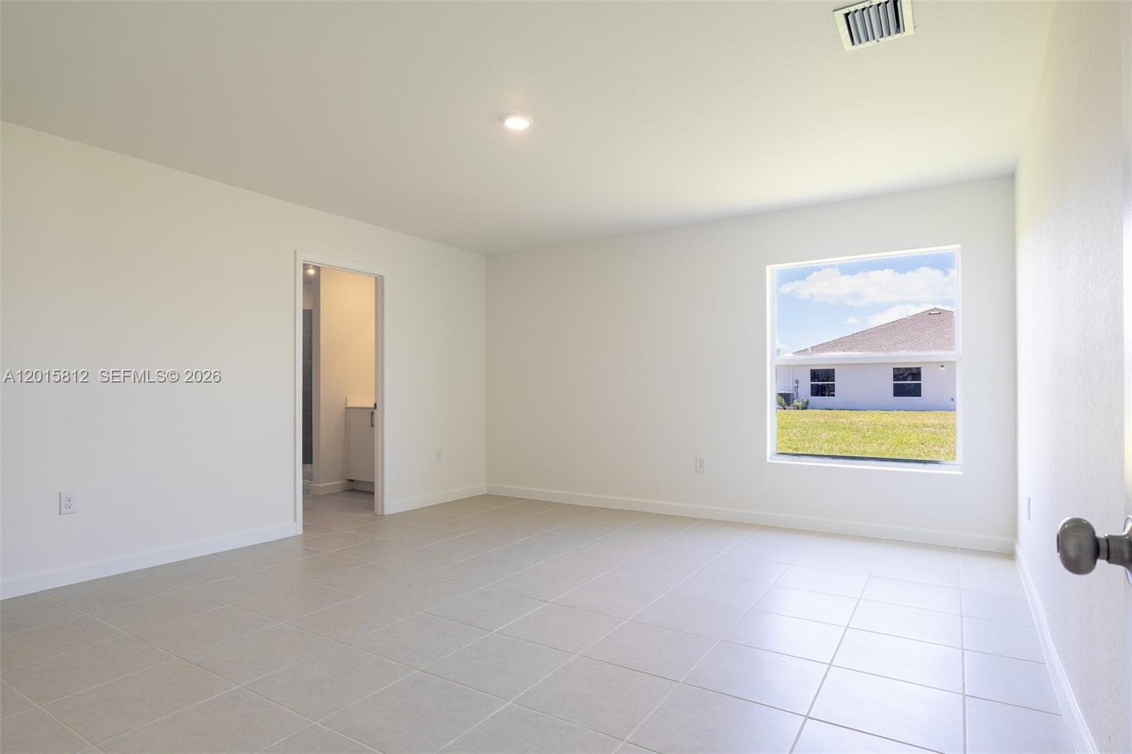 17564 Southwest 285th Street Homestead, FL 33030 - Photo 17 of 42 a view of an empty room and a window