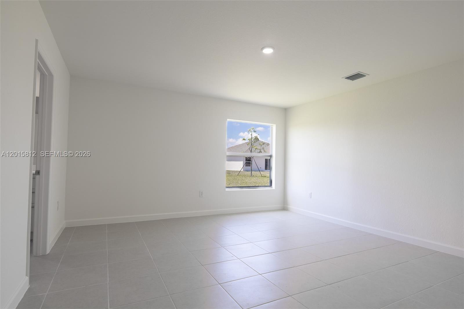 17564 Southwest 285th Street Homestead, FL 33030 - Photo 18 of 42 a view of an empty room with a window